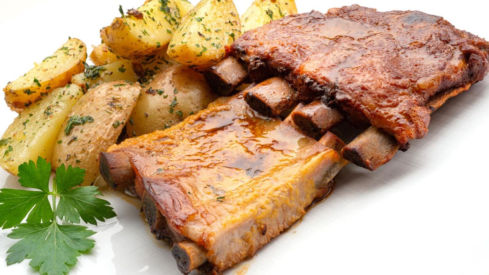 Churrasco de cerdo con patatas al ajo y orégano, receta de Karlos Arguiñano