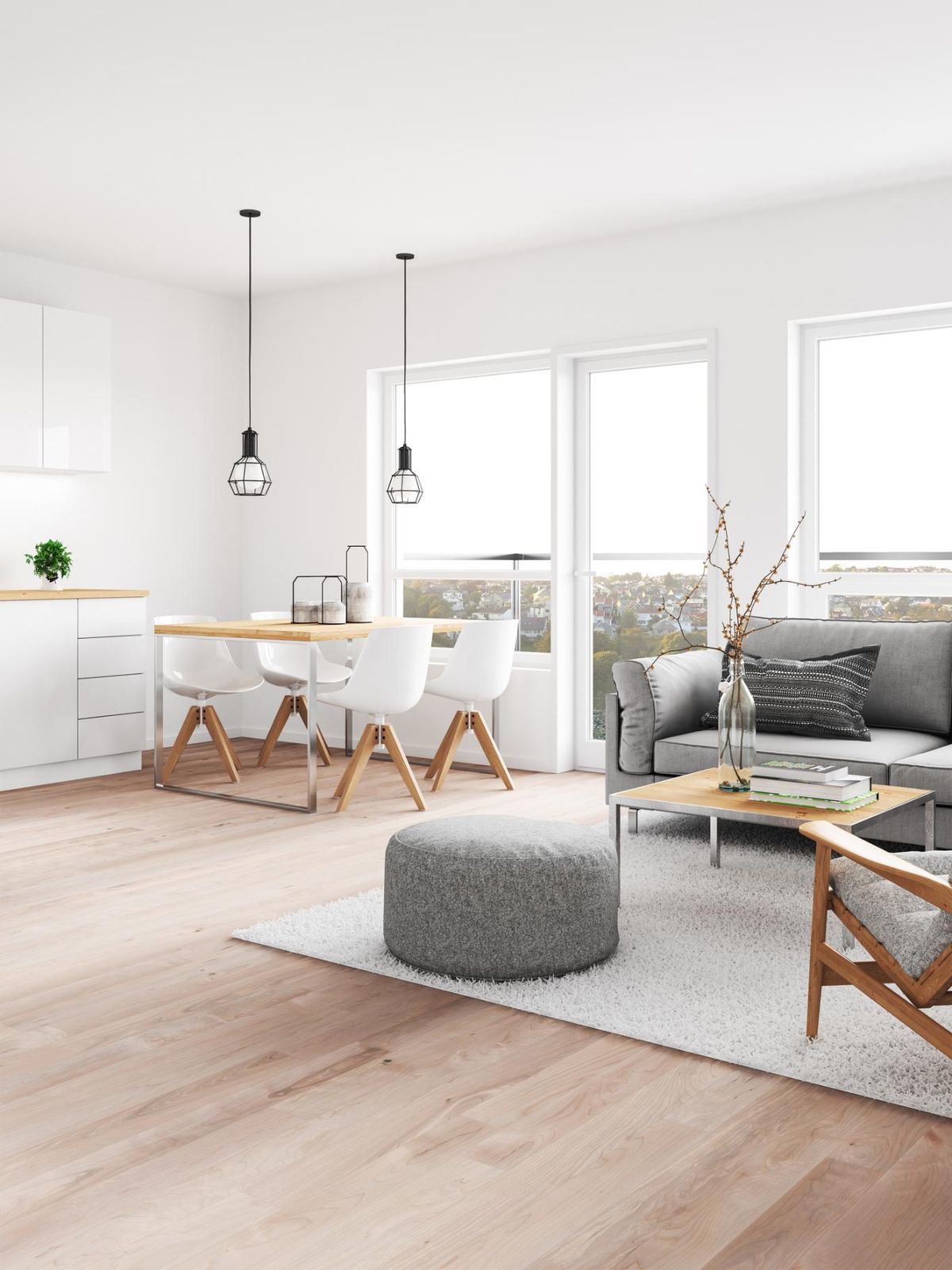 Salón comedor minimalista con lámparas geométricas colgantes.