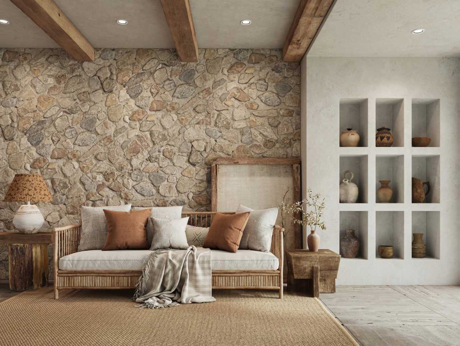 Salón rústico con pared de piedra.