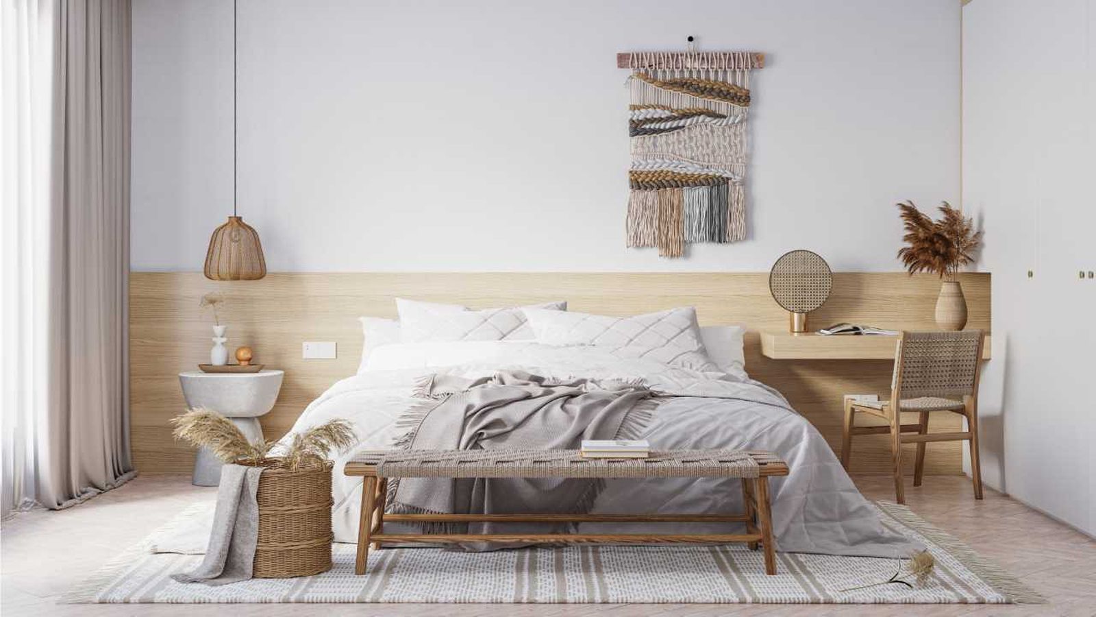 Dormitorio boho con lámpara de techo de fibras naturales.