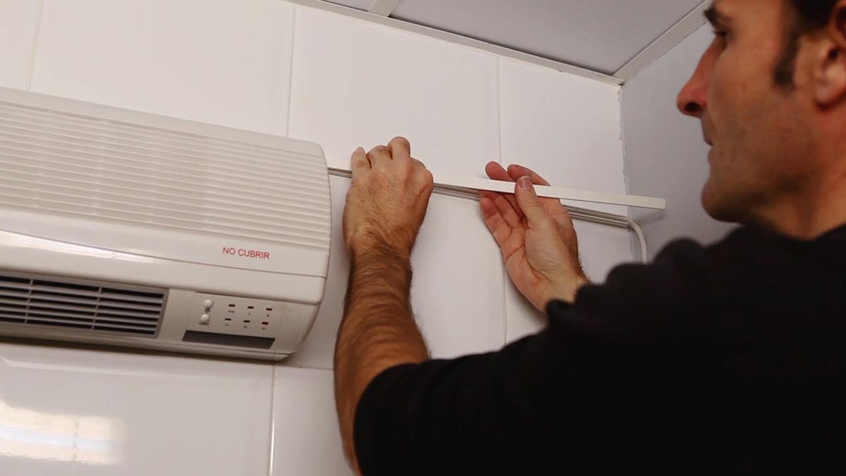 Cómo instalar un calefactor eléctrico de pared paso 11