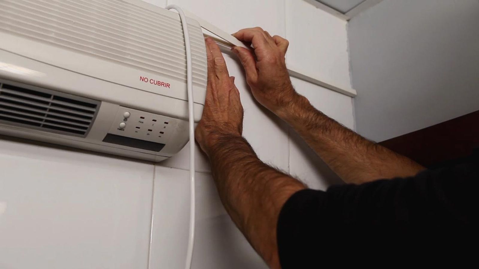 Cómo instalar un calefactor eléctrico de pared paso 10 Cómo instalar un calefactor eléctrico de pared paso 10
