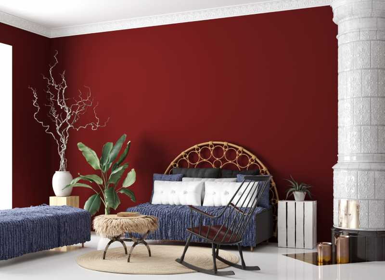 Dormitorio decorado en rojo Oporto con cabecero de ratán.