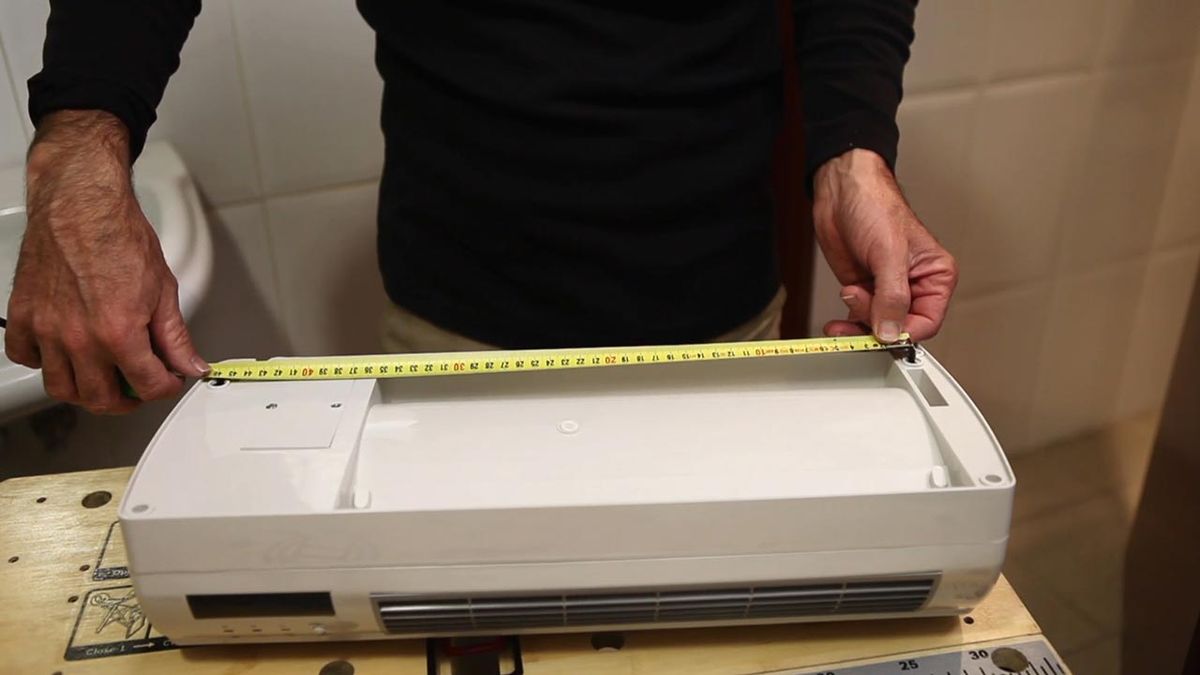 Cómo instalar un calefactor eléctrico de pared paso 2