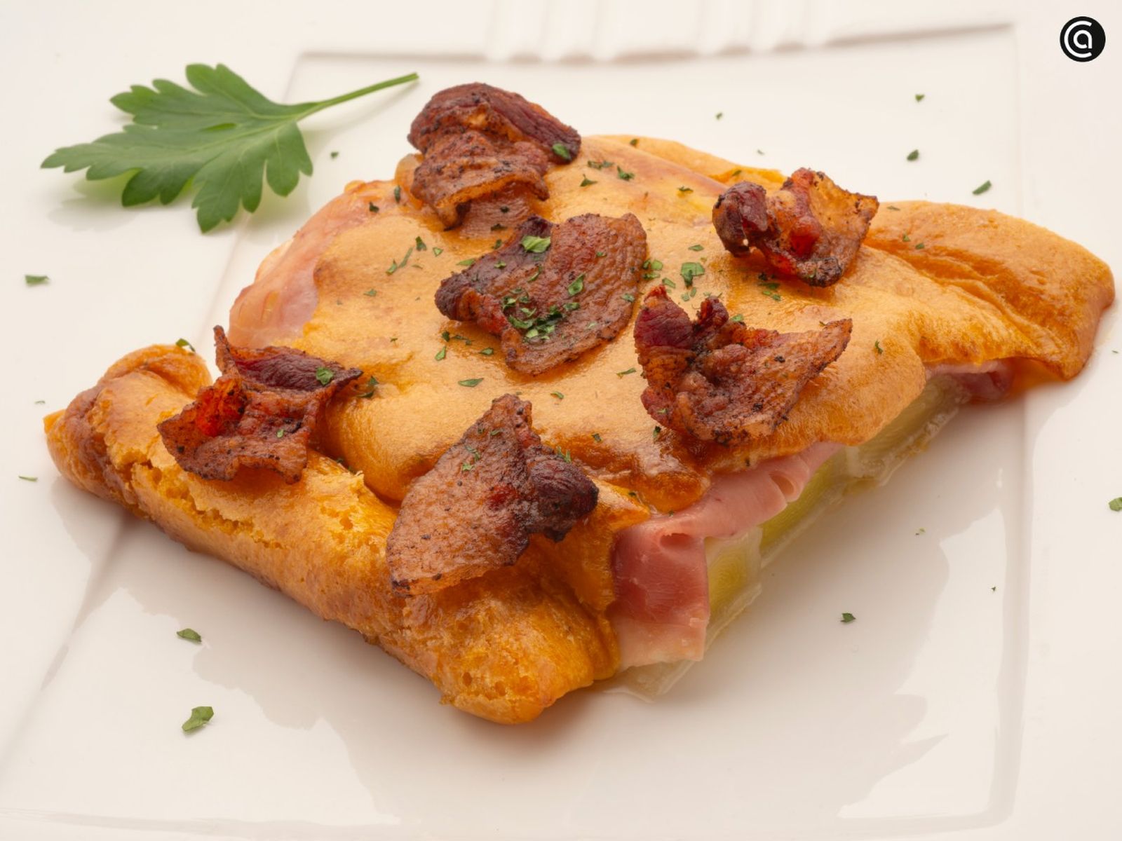 Puerros asados y gratinados con ibéricos, receta de Joseba Arguiñano