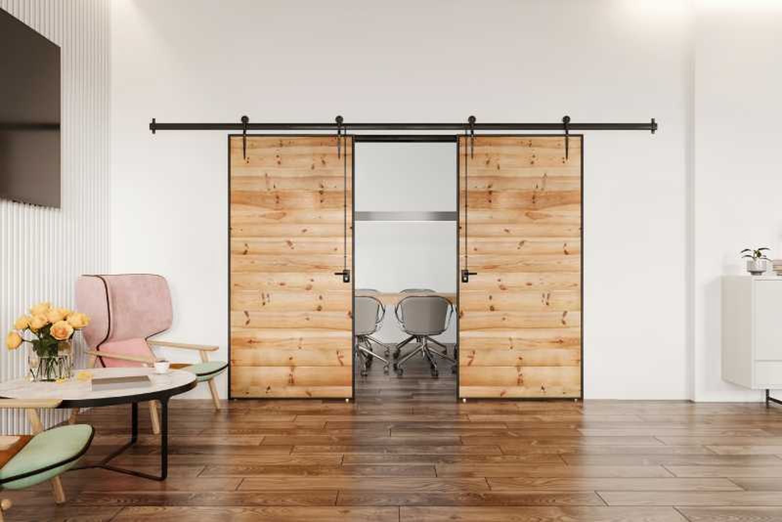 Salón con puertas de granero para separar ambientes. Salón con puertas de granero para separar ambientes.