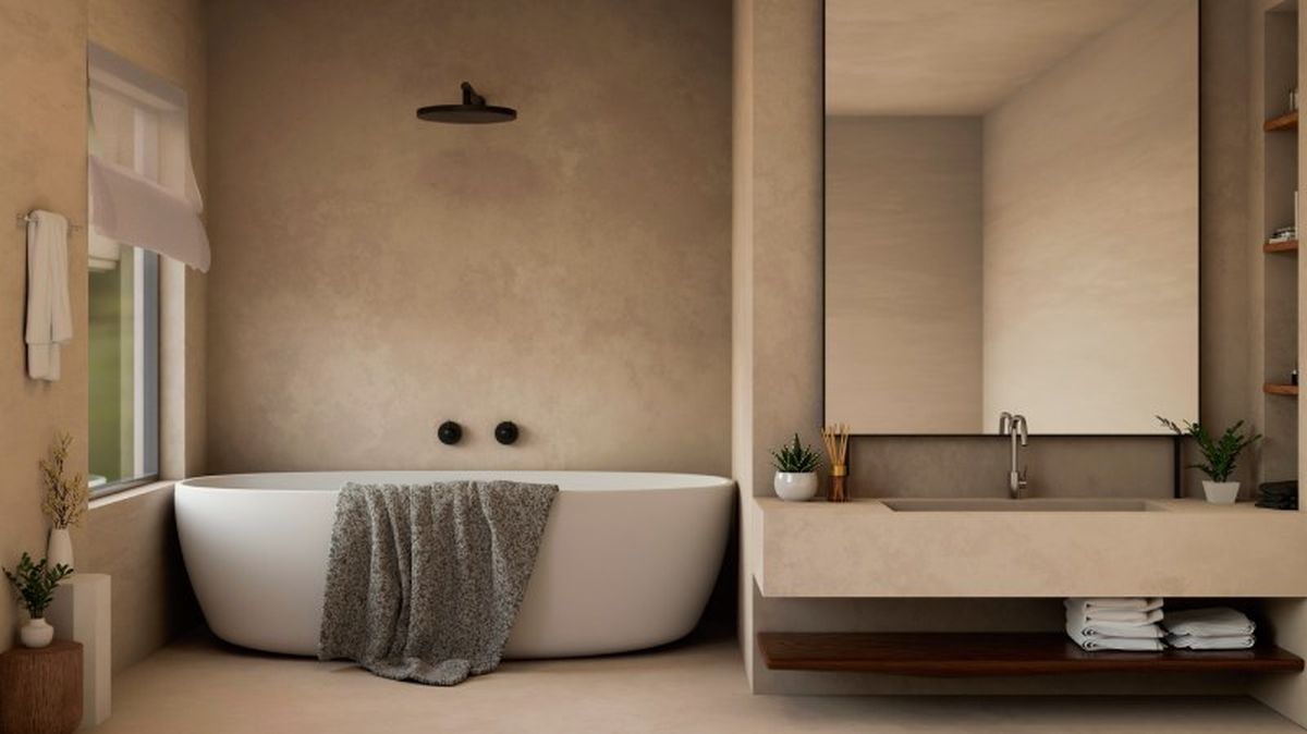 Un baño con paredes de microcemento