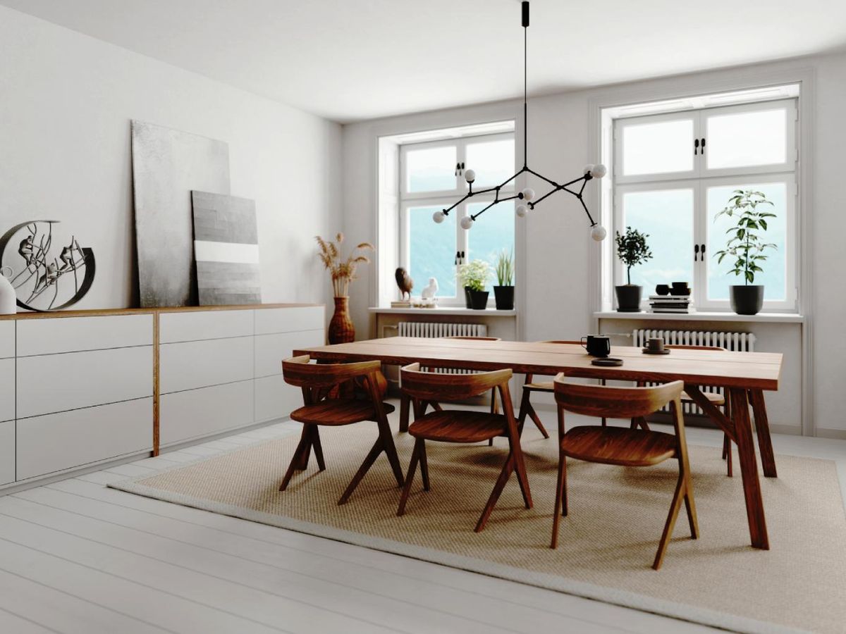 Comedor con muebles blancos y madera oscura