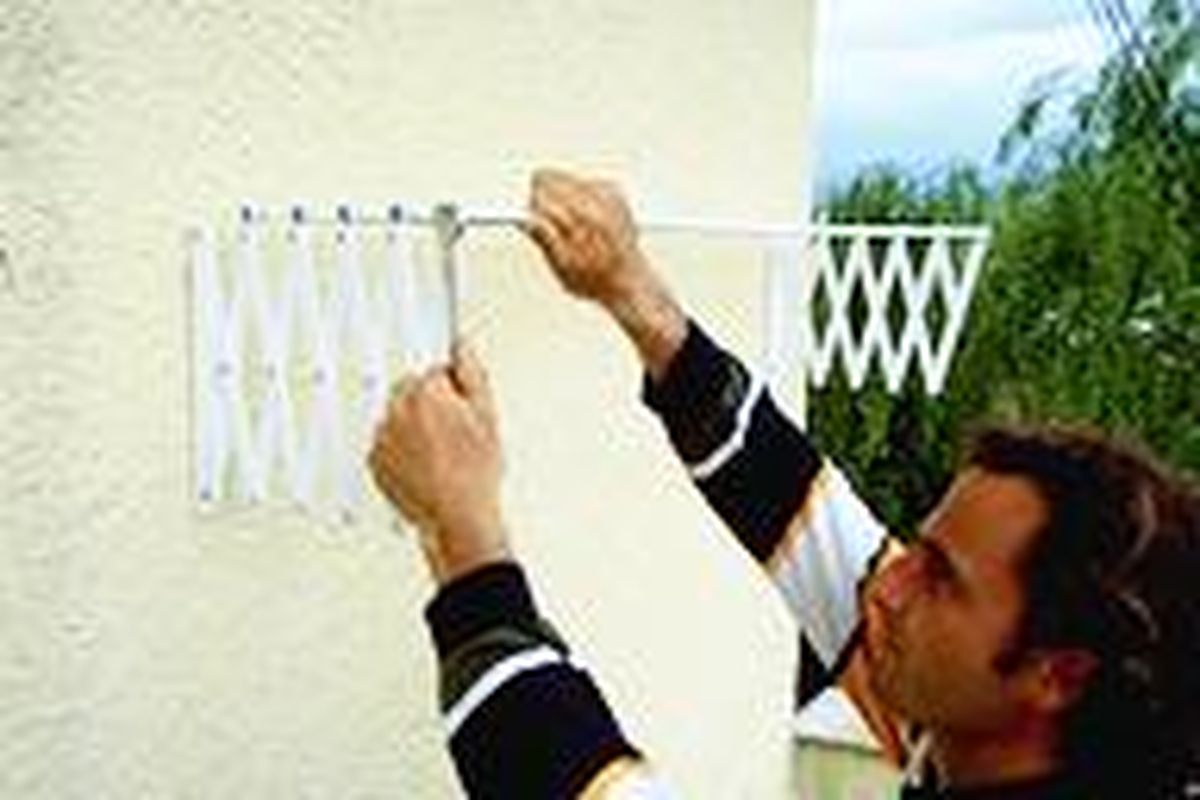 Colocar un tendedero de ropa extensible paso 4