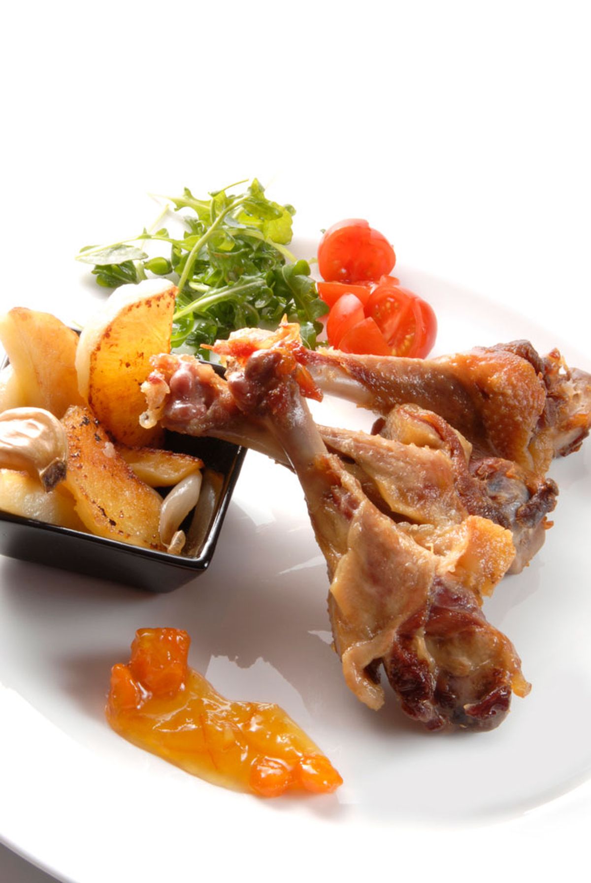 Alitas de pato con patatas y mermelada de naranja